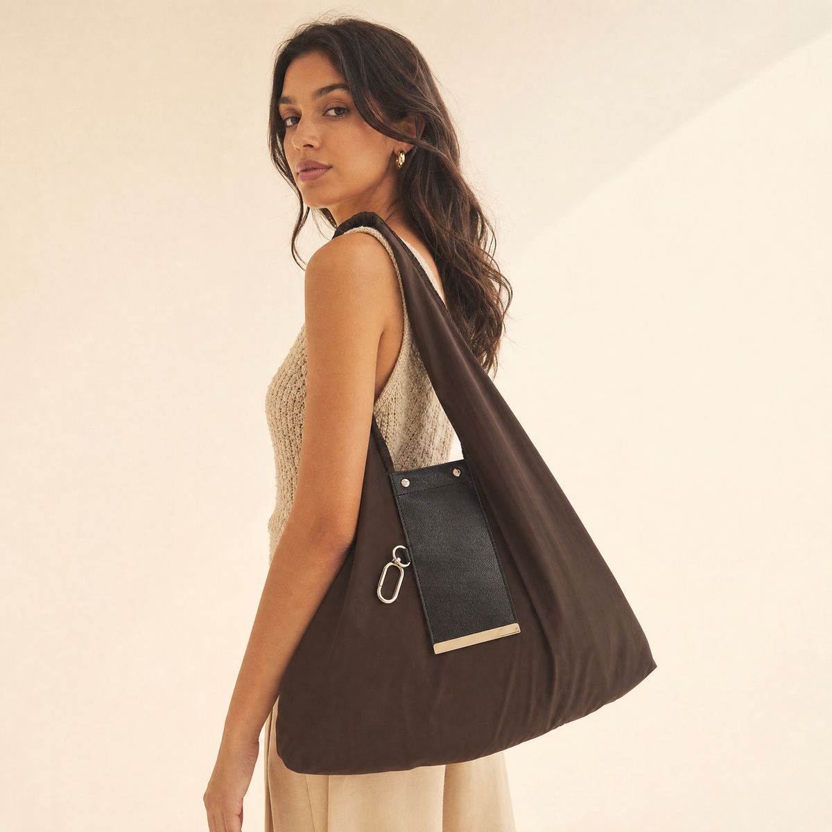 Chocolate foldable tote shopping bag carried by model