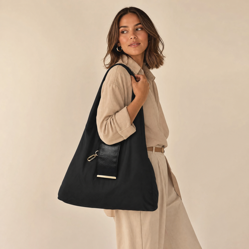 Black foldable tote shopping bag carried by model