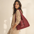 Burgundy foldable tote shopping bag carried by model